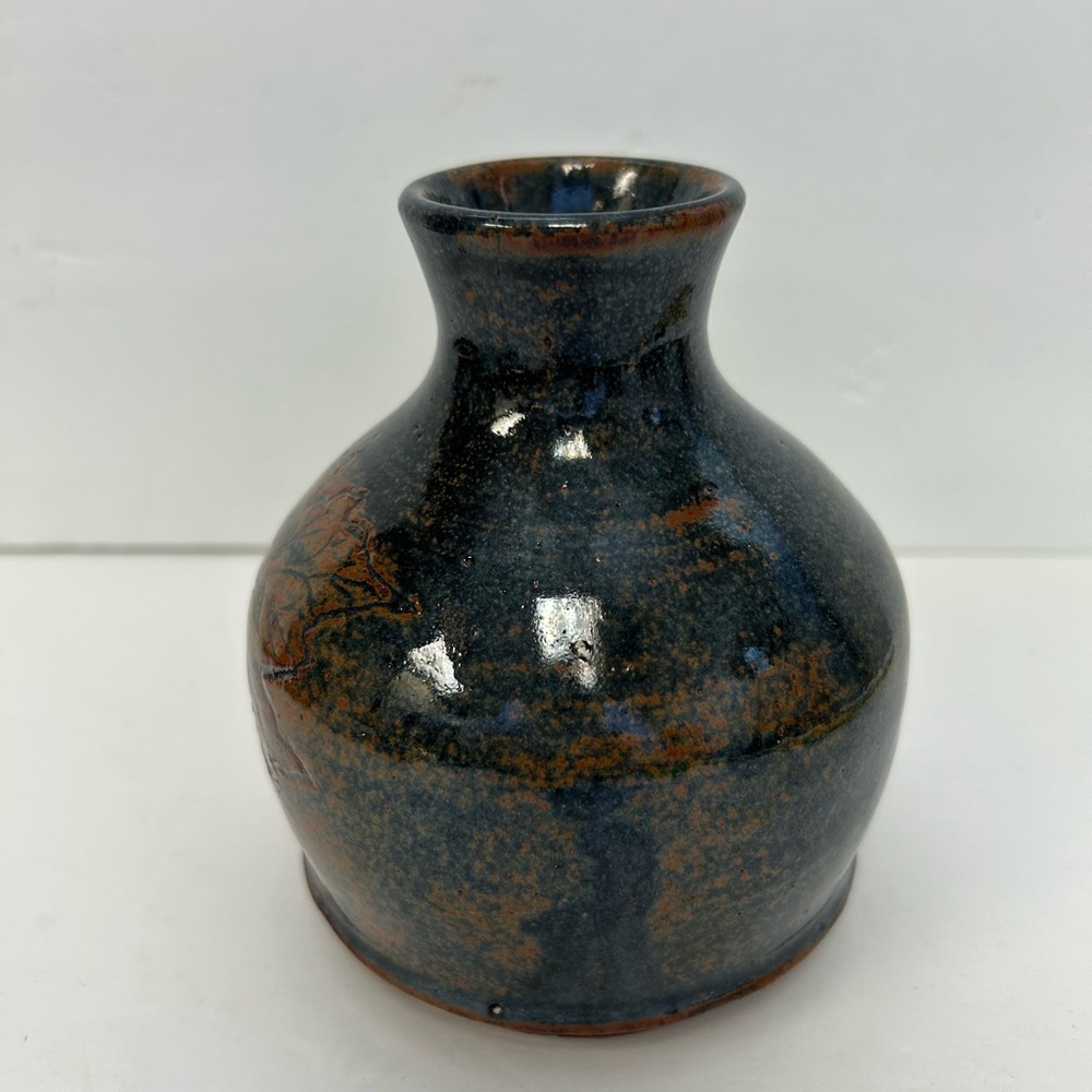 Handmade art pottery vase with a glossy glaze blend of blue and brown/ signed